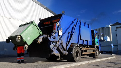 Hainault skip hire crew sorting recyclable materials on site