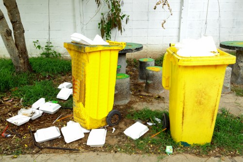 Mini and builders skips placed at a construction site